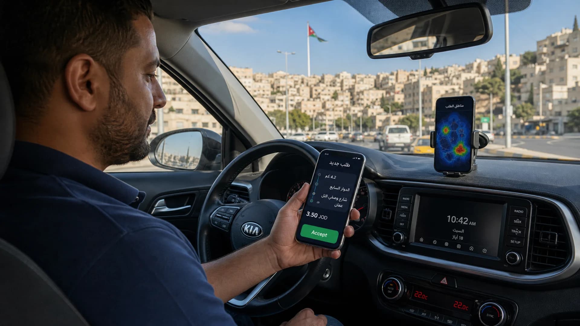 A taxi driver in Amman holding a phone running the Arabic Waslni driver app